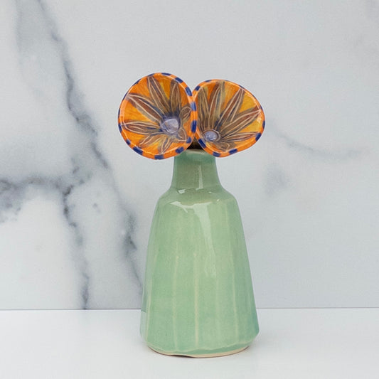 55 - FLOWER BOUQUET: Faceted Vase with Orange Blooms